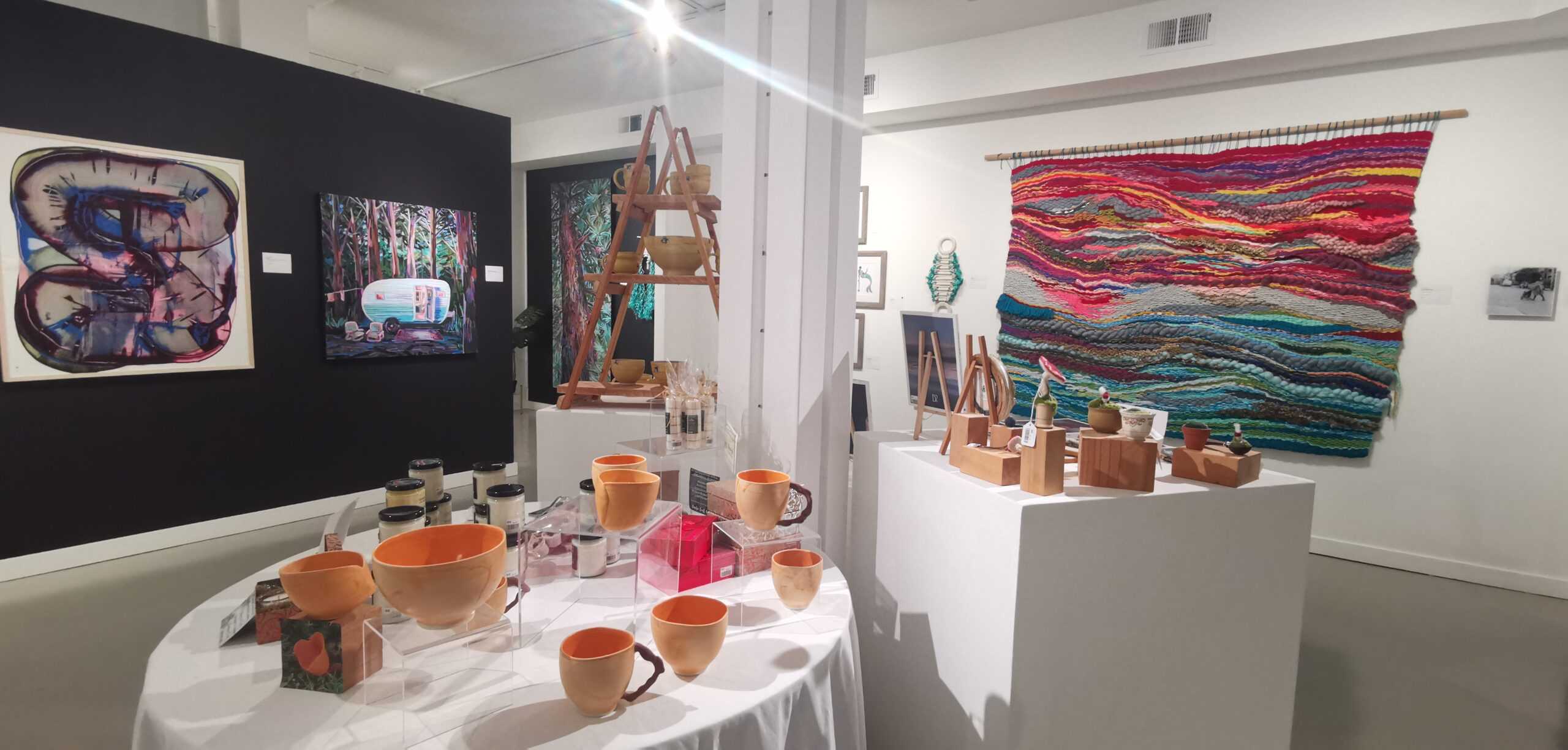 Pottery and a colourful wall hanging at the Holiday Faire