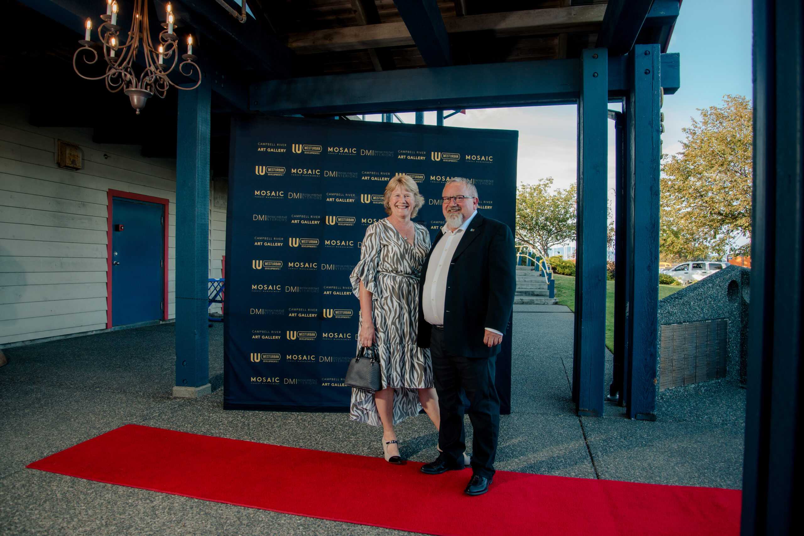 A couple on the red carpet at a gala