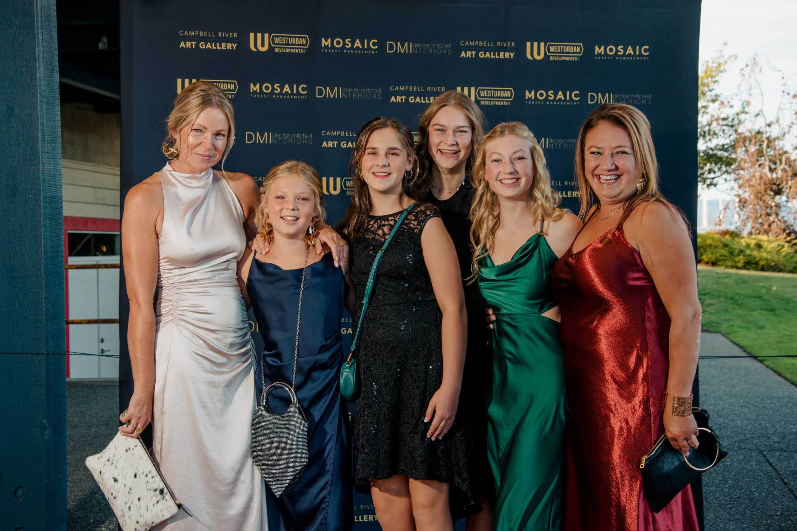 Group of six on the red carpet at the gala