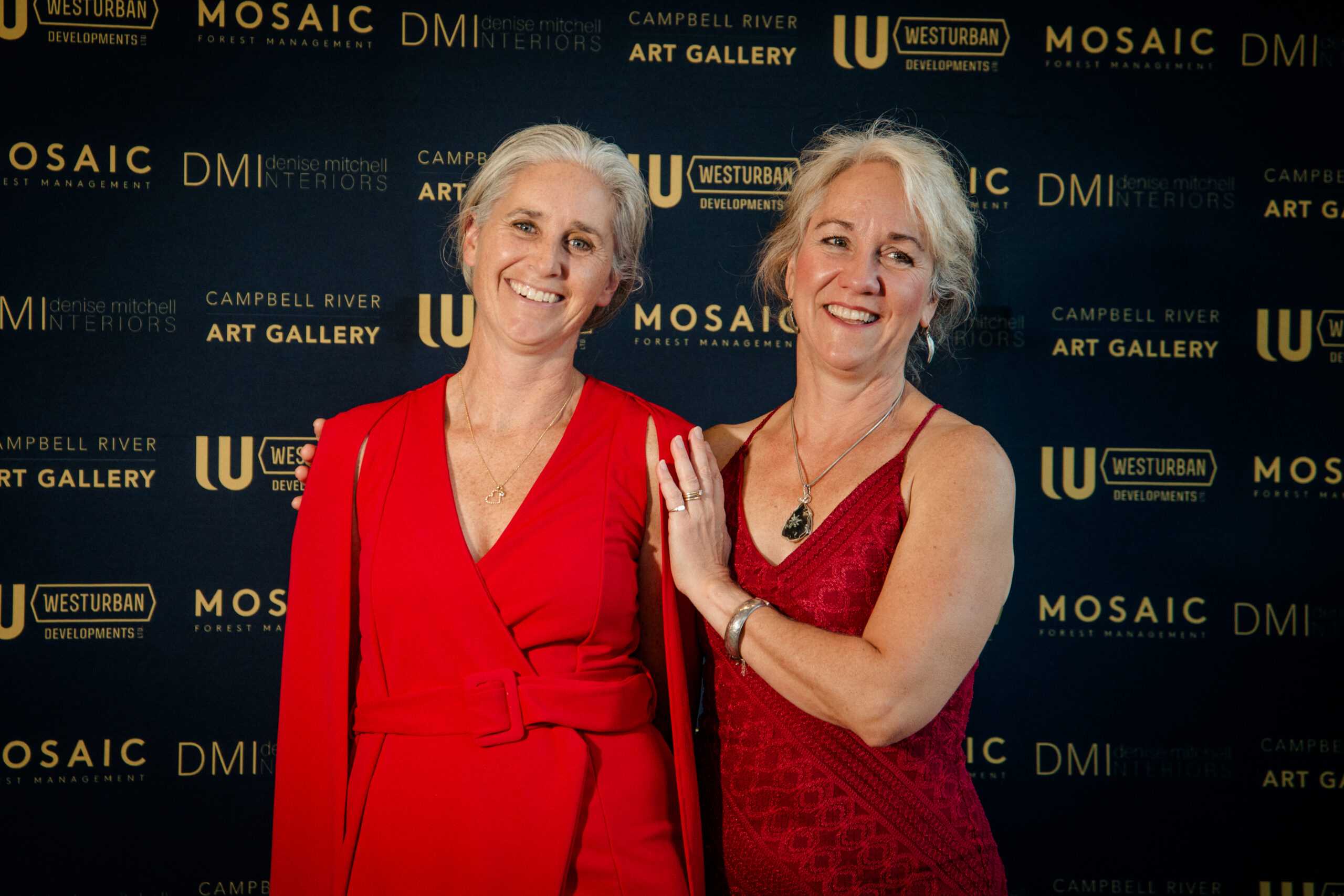 Two women posing on the red carpet at the gala